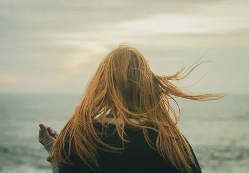 teenager or adolescent on the beac h likely experiencing emotional pain and seeking support in therapy or counseling.