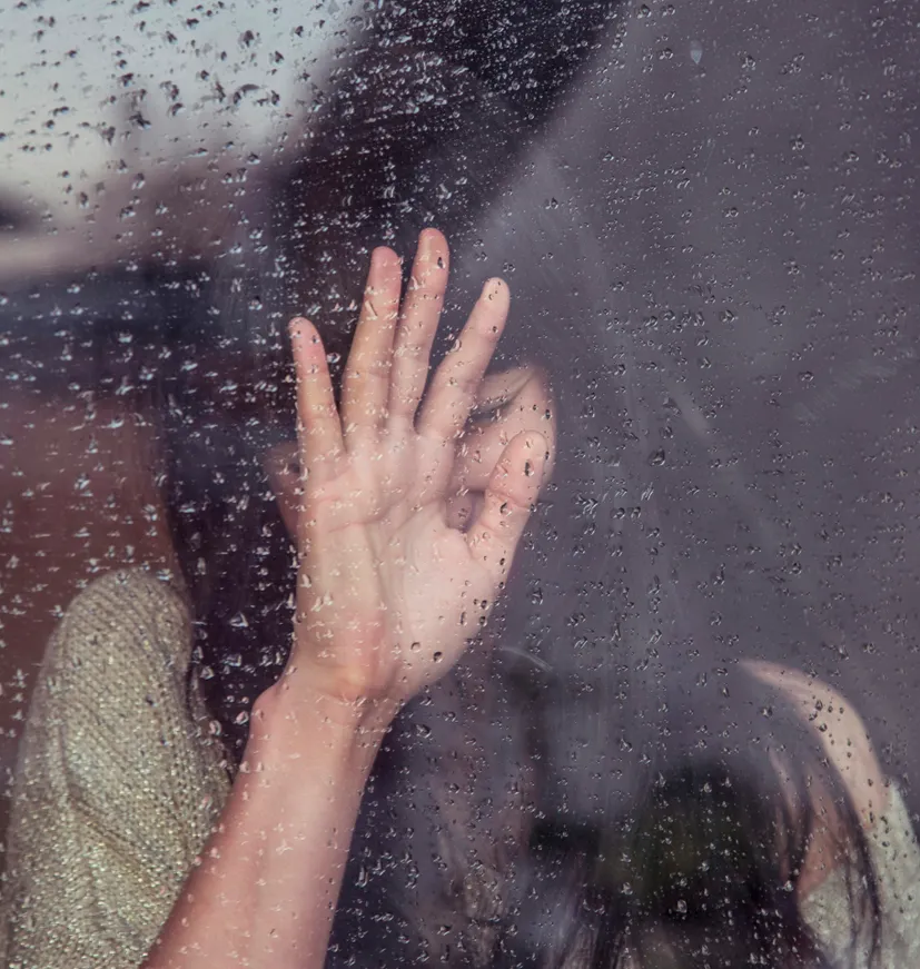woman anxious at window when someone leaves with separation anxiety before starting anxiety therapy in topsfield, MA.