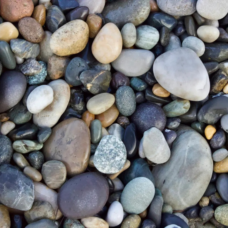 pebbles on beach symbolizng peace and tranquility achieved from particpating in therapy at north shore professional therapy with Sarah Haugh, LMHC